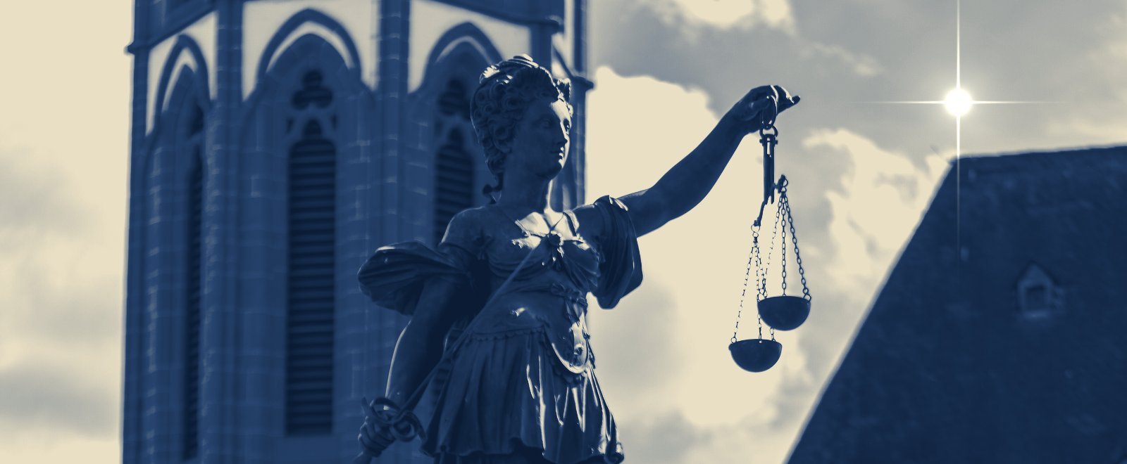 Lady Justice holding the scales, a symbol of tax defense representation
