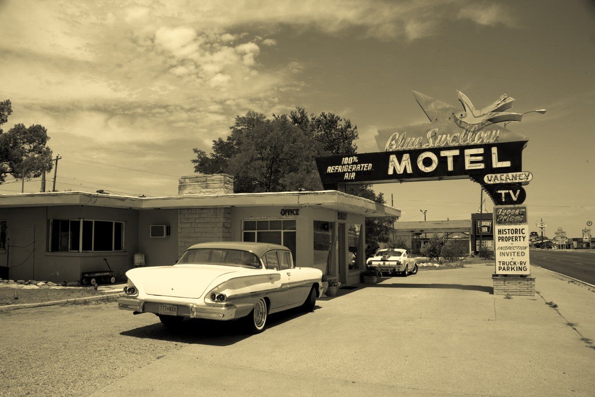 Vintage car parked outside the Blue Swallow Motel on Route 66 in Tucumcari, New Mexico
